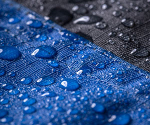 blue and black fabric with water droplets