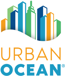 Logo with colorful abstract skyscrapers rising above the bold orange and blue capital letters, perfectly capturing the vibrant energy of Urban Ocean.